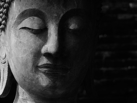 black and white buddha statue in Wat Yai Chaimongkol at Ayutthaya, Thailandの写真素材
