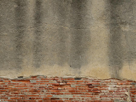 cracked concrete vintage brick wall backgroundの写真素材