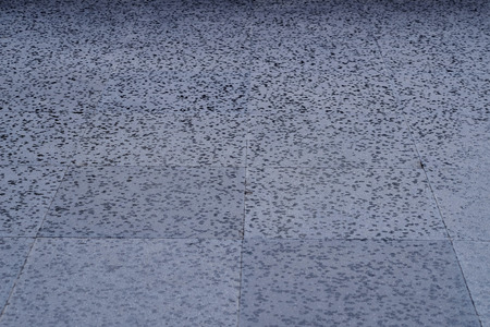 wet street floor with rain drop textureの写真素材
