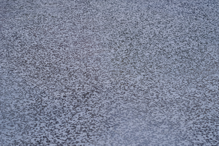wet street floor with rain drop textureの写真素材