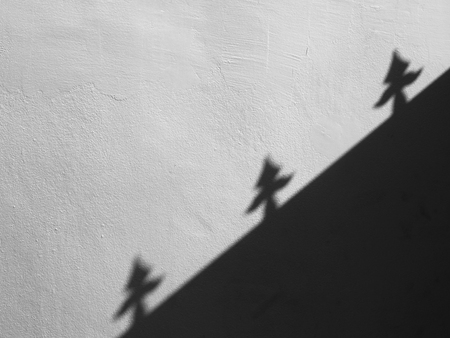 shadow of door on gray wall backgroundの写真素材