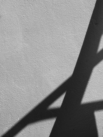 blur of shadow on silver wall backgroundの写真素材