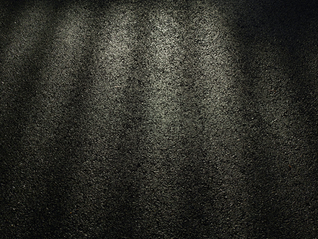 wet asphalt road with dark shadow of door and light of morningの写真素材