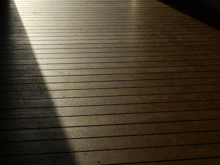 dirty wood floor with sunlight at morning