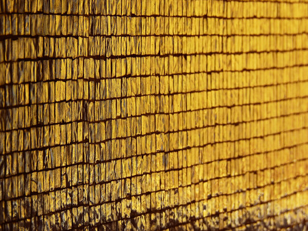 gold stone tile wall backgroundの写真素材
