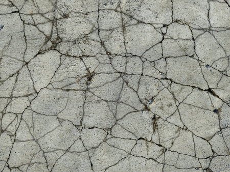 Cracked concrete texture closeup backgroundの写真素材