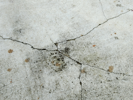 Cracked concrete texture closeup backgroundの写真素材