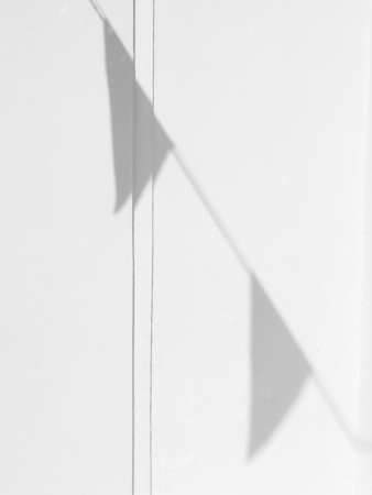 shadow of flag on white wall backgroundの写真素材