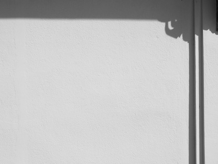 white wall with shadow backgroundの写真素材
