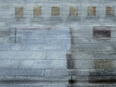 wet stone floor with water reflection after rain in temple Thailand
