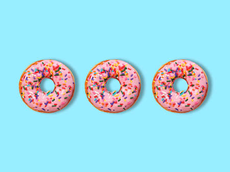 Creative look of pink donuts with colorful candies. Minimal dessert concept. 3d rendering.