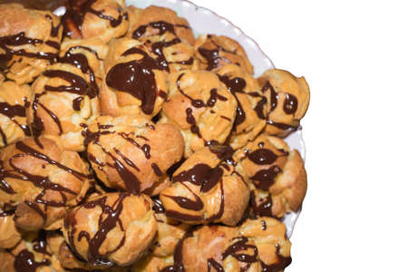 Chocolate poured eclairs isolated on white background.の写真素材