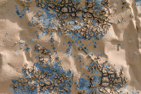 The texture of an old painted metal surface with cracked paint from old age.の写真素材