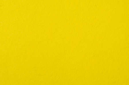 Texture of yellow fleecy rag cloth for wiping surfaces.