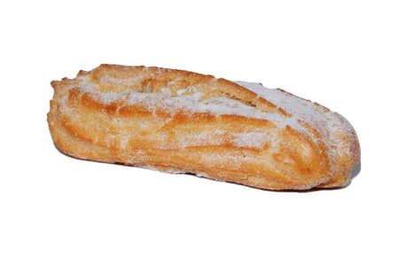 Oblong eclair made of puff pastry sprinkled with powdered sugar isolated on a white background with...