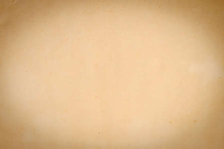 The texture of an old yellowed paper with a vignette. Mockup.の写真素材