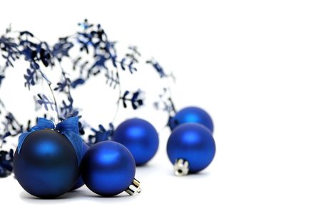 Blue Christmas balls and tinsel isolated on a white background.の写真素材