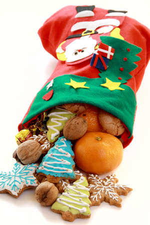 Beautiful Christmas stocking with gifts isolated on a white background.の写真素材