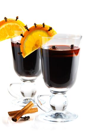 Mulled wine in glass, decorated with orange, cinnamon and clove.の写真素材