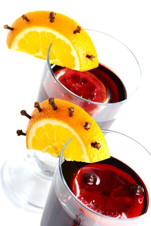Mulled wine in glass, decorated with orange, cinnamon and clove.の写真素材