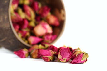 Tea from a tea-rose buds isolated on a white background. の写真素材