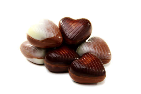 Chocolates in the shape of a heart on a white background.の写真素材