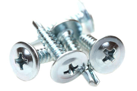Closeup of steel screws on a white background. の写真素材