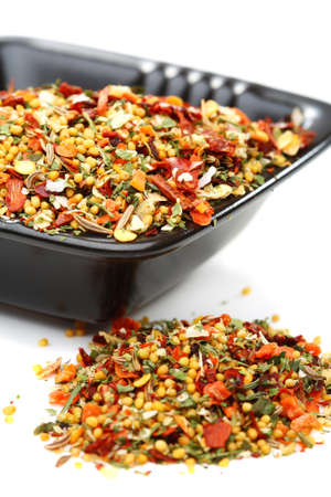 Mixture of spices in a bowl on a white background.の写真素材