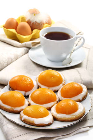 Easter biscuits and a cup of tea on a linen napkin.の写真素材