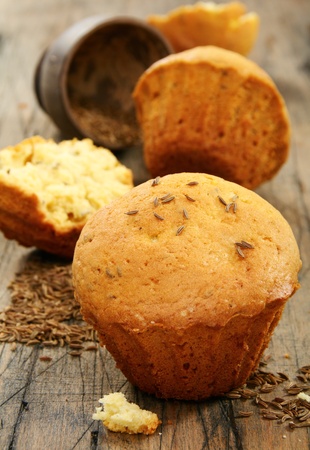 Cupcakes with caraway seeds on an old wooden table.の写真素材