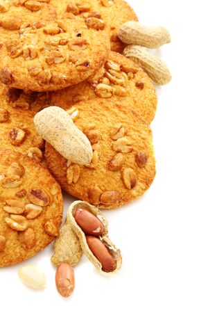 Nut biscuits and peanuts closeup on a white background.の写真素材
