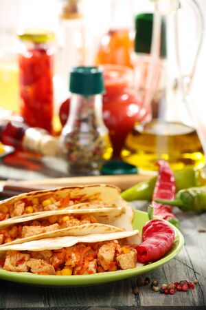 Fresh wheat tortillas stuffed with spicy chicken  の写真素材