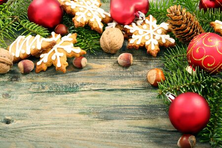Gingerbread cookies with fir cones and Christmas toys on a wooden table  の写真素材