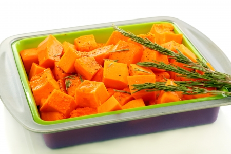 Spiced pumpkin and rosemary in a baking dish  の写真素材