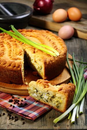 Pie with egg and onion on a linen napkin の写真素材