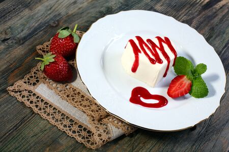 Panna cotta in the shape of a heart with cherry sauce の写真素材