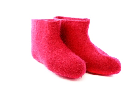 Short pink felt boots on a white background の写真素材