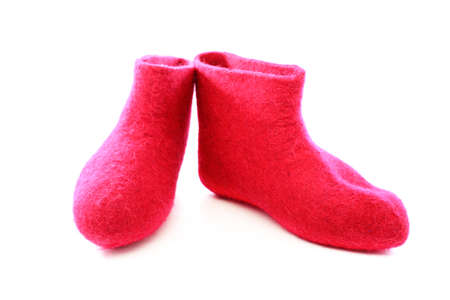 Bright pink felt boots on a white background の写真素材