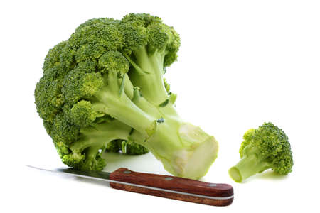 Broccoli and kitchen knife on a white background  の写真素材