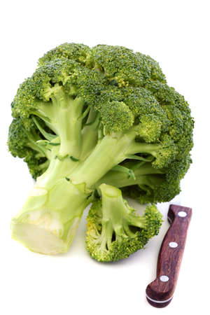 Broccoli and kitchen knife on a white background の写真素材