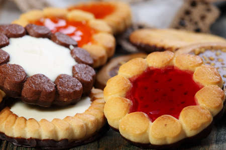 Biscuits with different fillings closeup on wooden table  