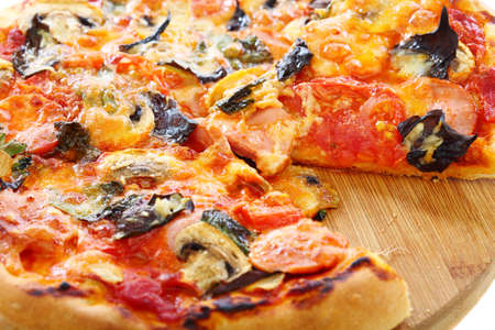 Pizza with tomatoes, mushrooms and purple basil.の写真素材