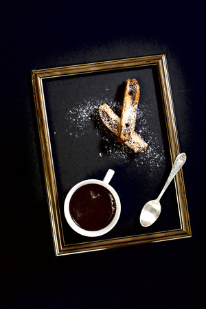 Coffee, biscotti and a teaspoon of the frame.