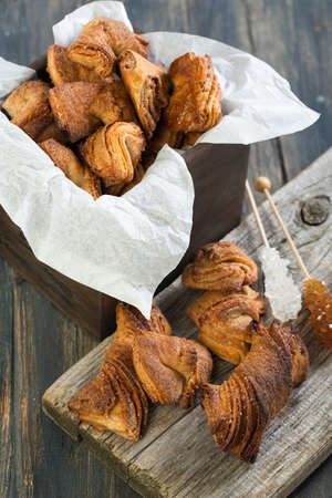 Cookies with cinnamon on a wooden table.の写真素材