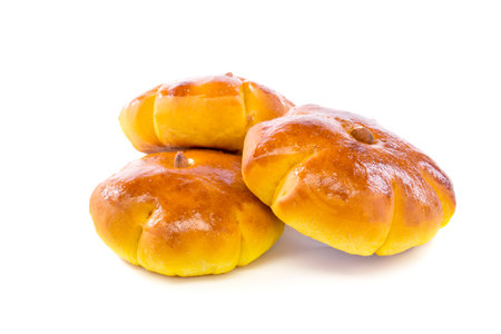 Fresh pumpkin buns on a white background.