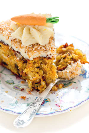 Plate of carrot cake on a white background.の写真素材