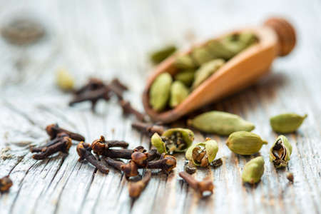 Dry beans cardamom and clove buds close-up.の写真素材