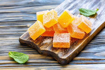 Homemade orange marmalade on the wooden serving Board, selective focus.の写真素材