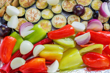 Tray with eggplant, peppers and onions for roasting.の写真素材