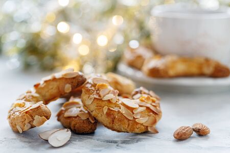 Crescent cookies with almond flakes on the festive table closeup selective focus.の写真素材
